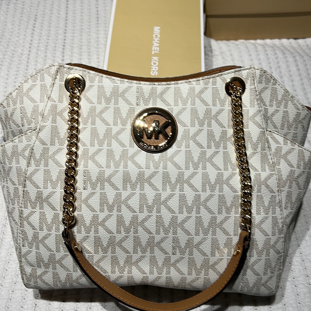 Michael Kors vanilla color with gold tone hardware